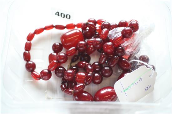 Two cherry amber bead necklaces (one with detached pendant)